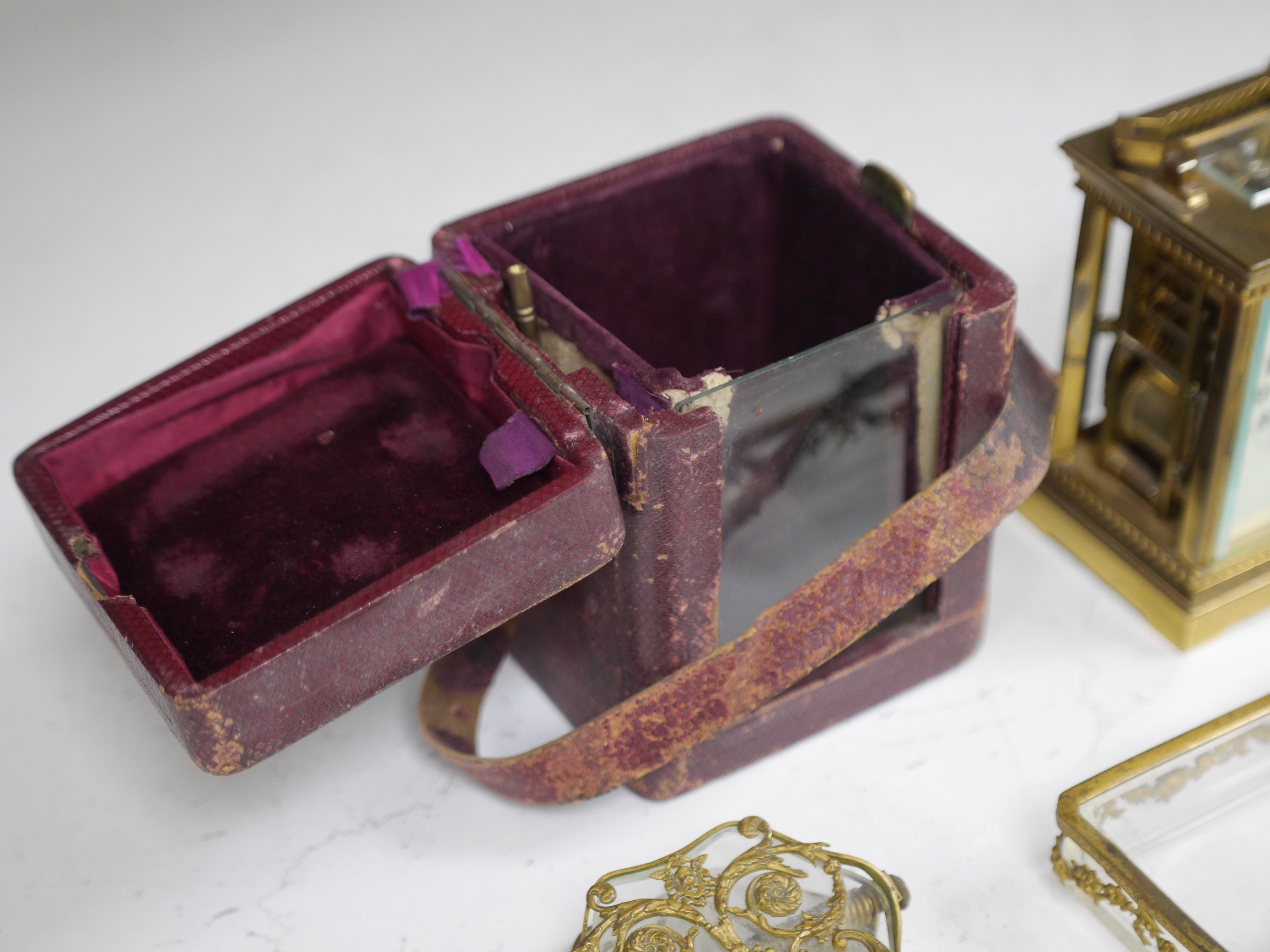 A brass cased carriage clock and five ormolu mounted glass desk accessories, clock 12cm high. Condition - unknown if clock working, desk accessories fair to good condition.